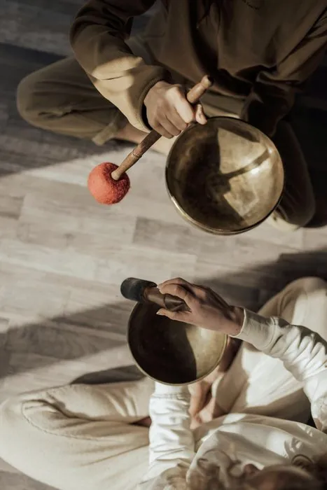 Two singing bowls in a sound healing session